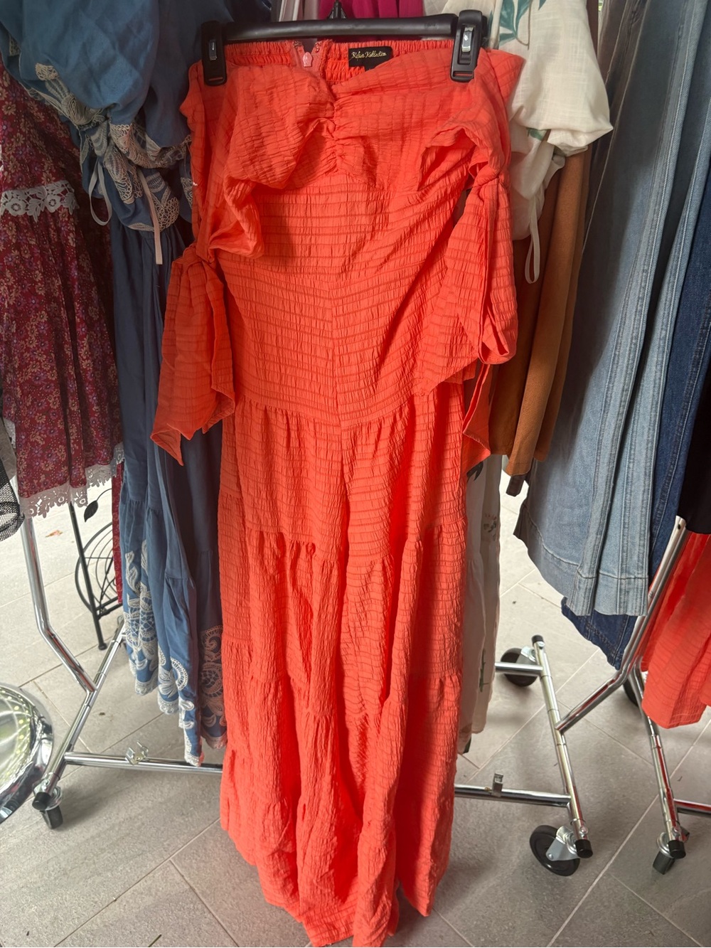 NWT Off-Shoulder Orange Jumpsuit with Tie big statement legs. Sizes S, M, L.